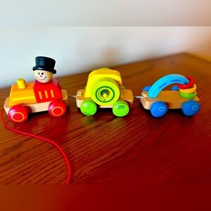 Hape Brand made in Switzerland 
Hard to find wooden train pull toy!!